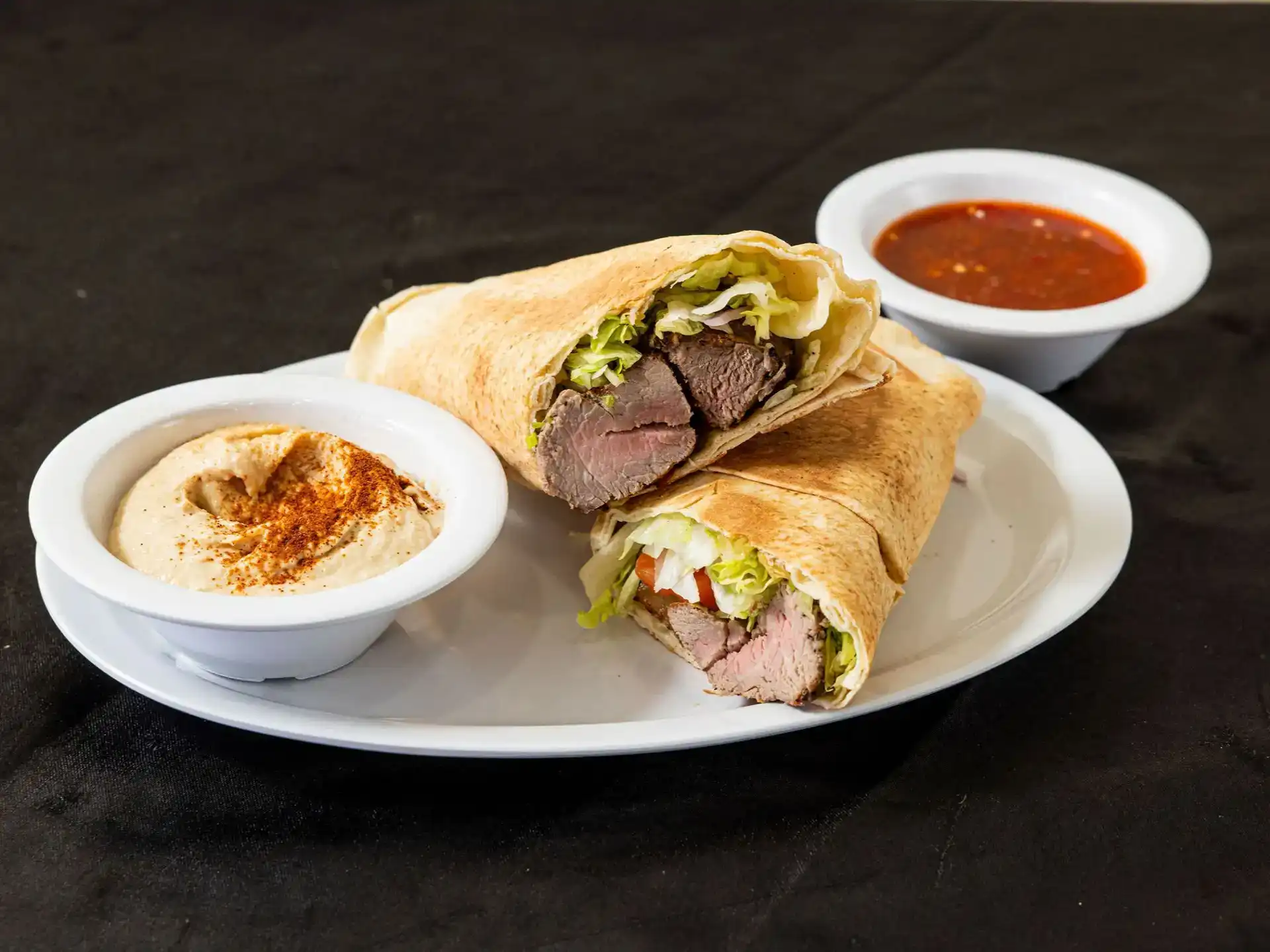 Beef Kebab Pita Wrap at Shawarma House SD — open-flame grilled halal beef kebab in warm pita with garden salad, hummus, and toum — Iraqi-Mediterranean in Ocean Beach, San Diego