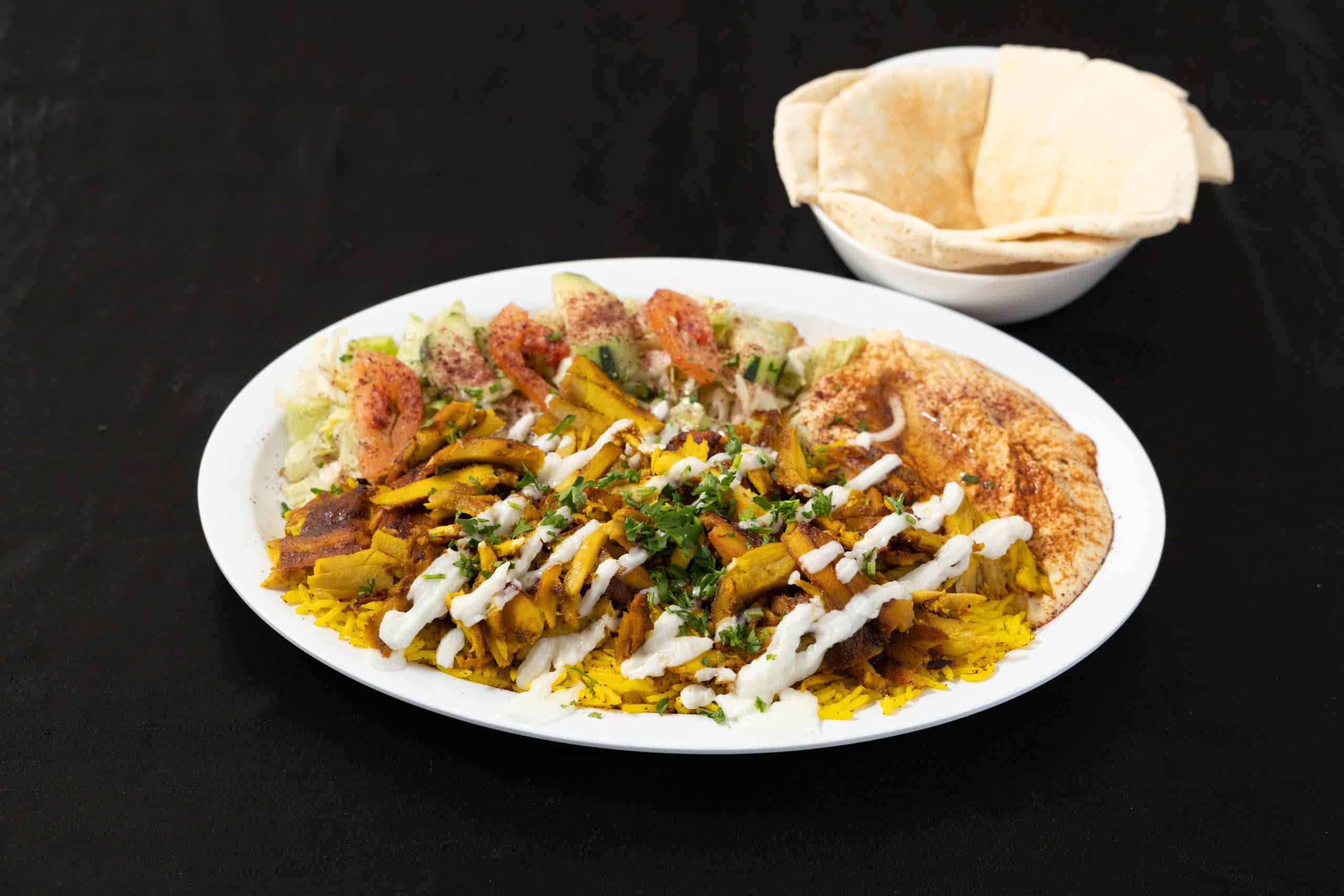 Chicken Shawarma Plate at Shawarma House SD — halal chicken shawarma marinated in baharat and sumac, slow-roasted on the spit, hand-shaved over saffron basmati with salad, hummus, and pita — San Diego