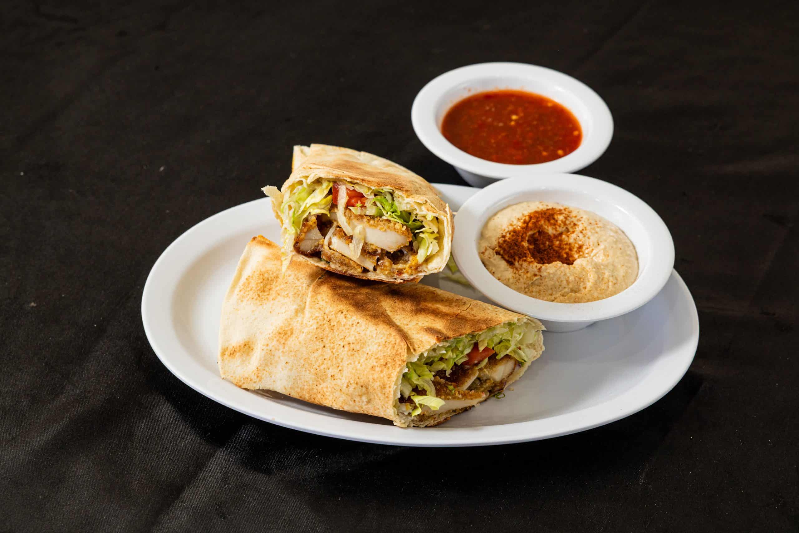 Cream Chop Pita Wrap at Shawarma House SD — chopped chicken cream chop with garlic finish in warm pita with crisp salad and toum — Iraqi-Mediterranean comfort food in San Diego