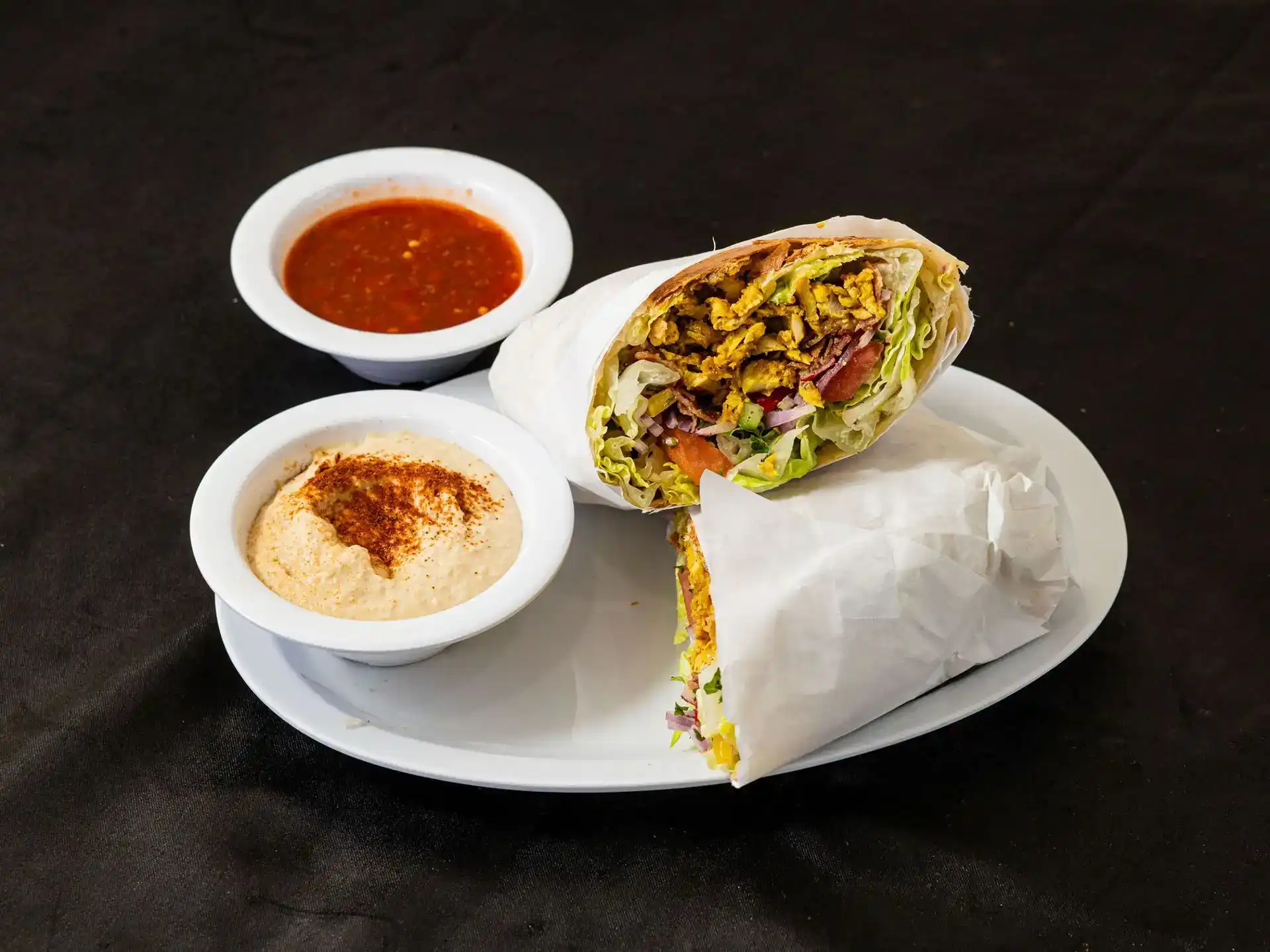 Fattoush Burrito at Shawarma House SD — flour tortilla with shawarma, fattoush salad with sumac and crispy pita chips, and toum or tahini — Iraqi-Mediterranean in San Diego