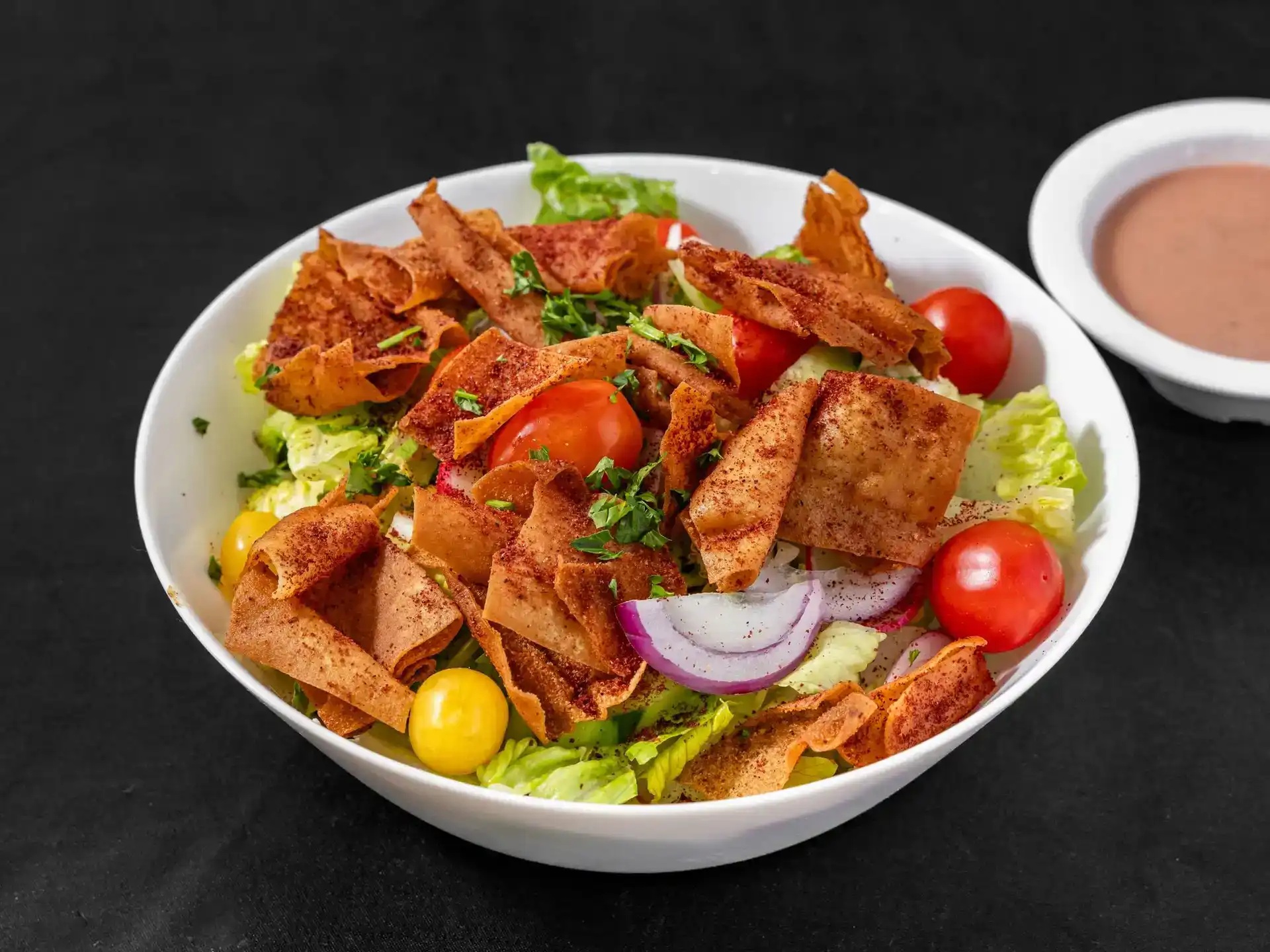 Fattoush Salad at Shawarma House SD — Levantine salad of crisp romaine, fresh herbs, sumac, and crispy pita chips with house fattoush dressing — vegan Mediterranean in Ocean Beach
