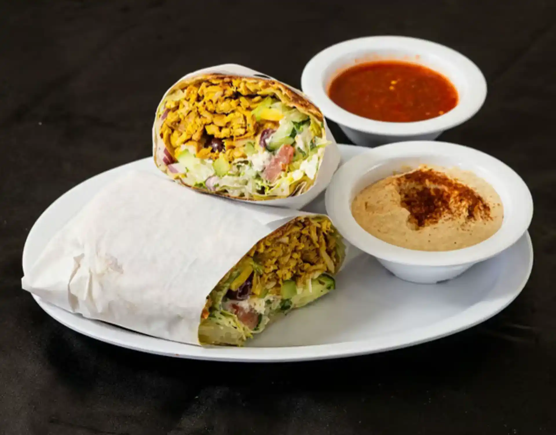 Greek Burrito at Shawarma House SD — flour tortilla with shawarma, Greek salad with feta and kalamata olives, and tzatziki — Mediterranean restaurant in Ocean Beach, San Diego