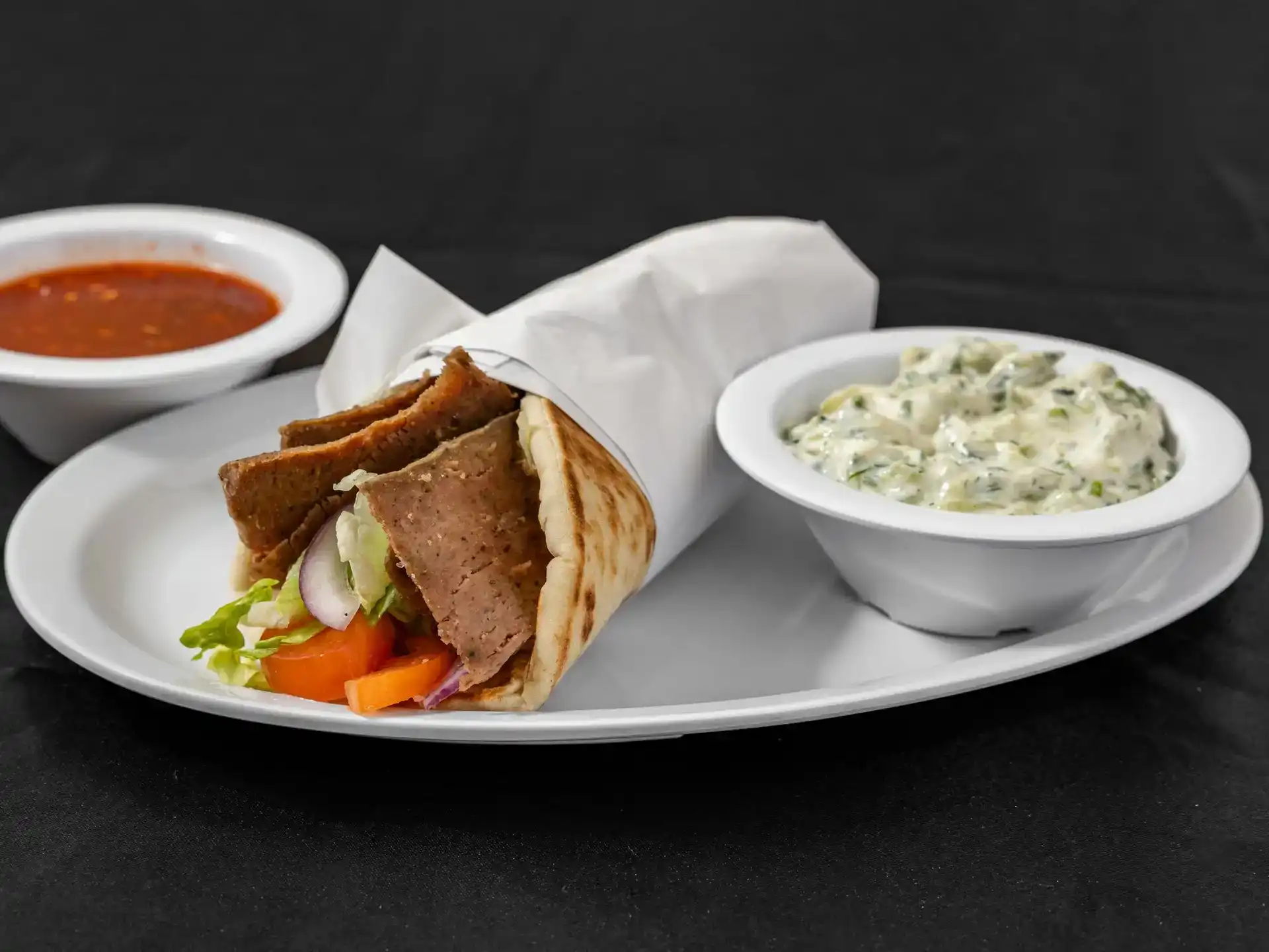 Gyro Pita Wrap at Shawarma House SD — classic spit-roasted gyro hand-shaved into warm pita with crisp salad and house tzatziki — Mediterranean restaurant in Ocean Beach