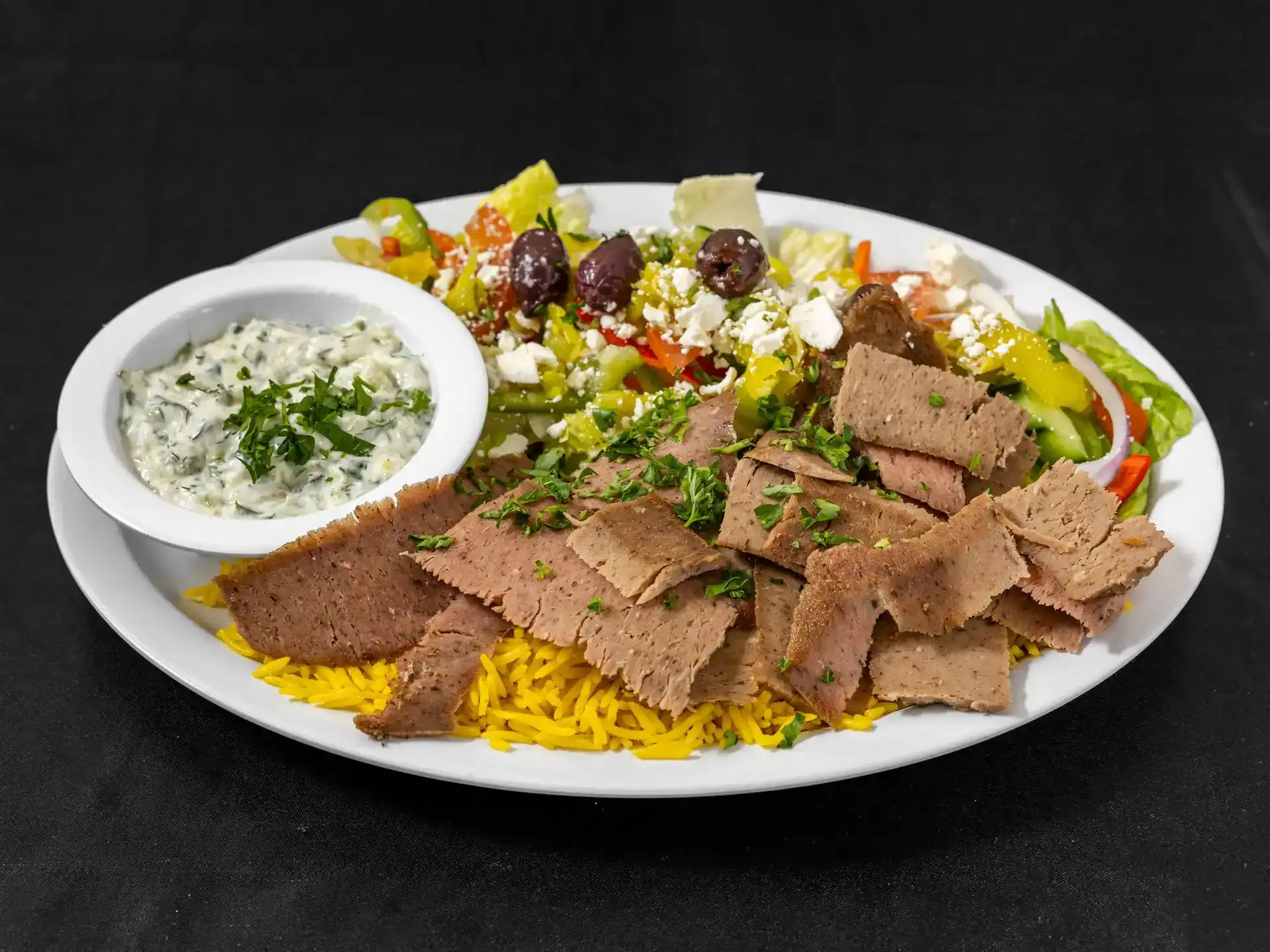 Gyro Plate at Shawarma House SD — classic vertical-spit gyro hand-shaved over saffron basmati with crisp salad, hummus, warm pita, and house tzatziki — Mediterranean restaurant in Ocean Beach