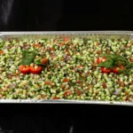 Iraqi Salad Tray at Shawarma House SD — catering tray of Iraqi-Mediterranean chopped salad with diced tomato, cucumber,