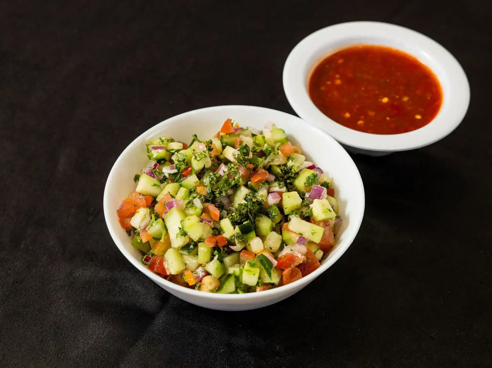 Iraqi Salad at Shawarma House SD — Iraqi-Mediterranean chopped salad with diced tomato, cucumber, fresh herbs, and olive oil — vegan starter in Ocean Beach, San Diego