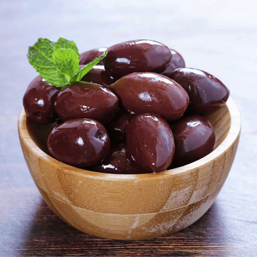Kalamata Olives at Shawarma House SD — 4oz cup of briny meaty Greek kalamata olives — vegan Mediterranean snack in Ocean Beach, San Diego