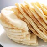 Pita Bread at Shawarma House SD — single warm pita straight off the press, soft and slightly chewy — Mediterranean in Oc