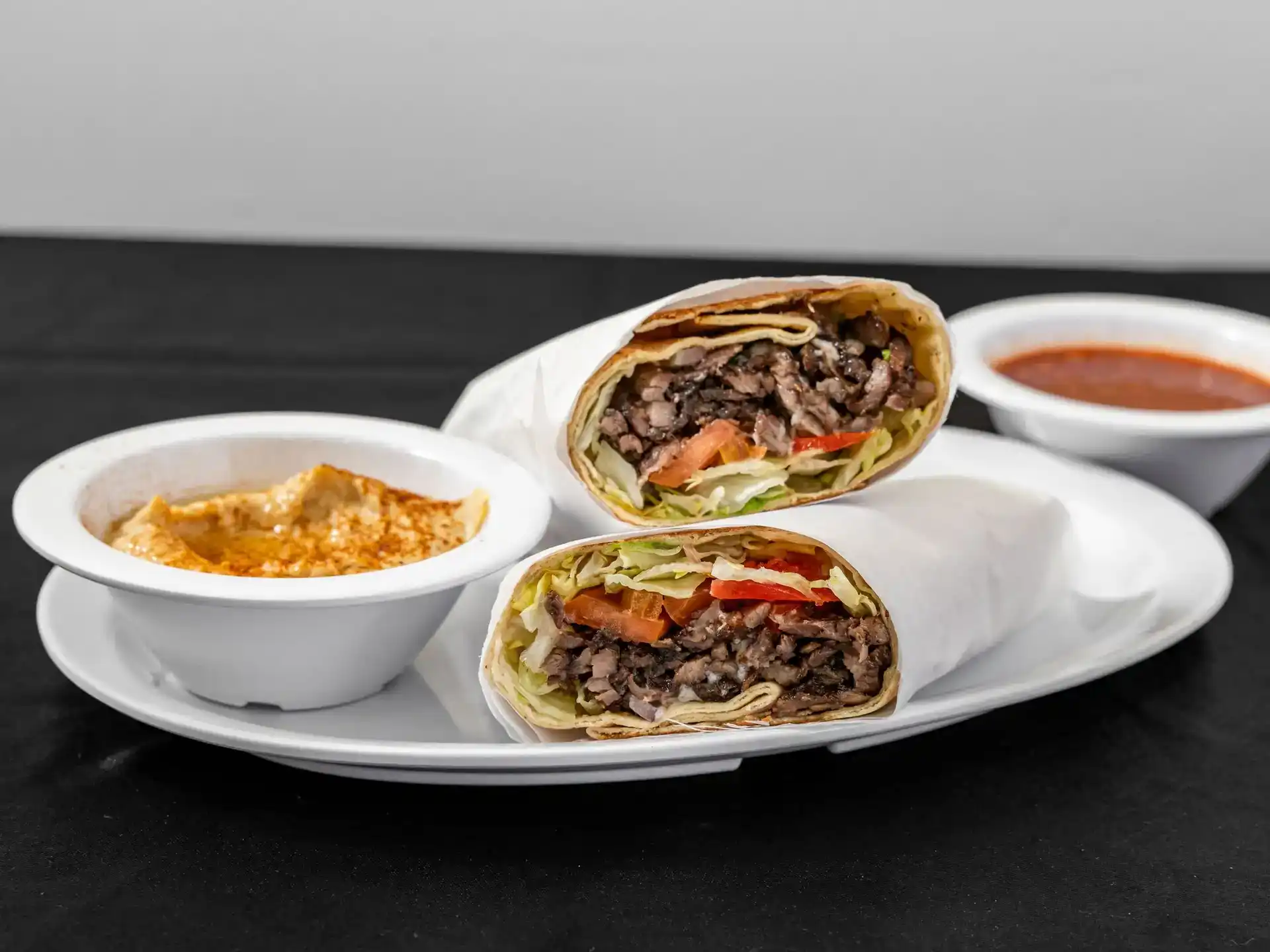 Shawarma Portion Pita Wrap at Shawarma House SD — extra-heaping shawarma portion in warm pita with garden salad and toum — Iraqi-Mediterranean restaurant in Ocean Beach, San Diego