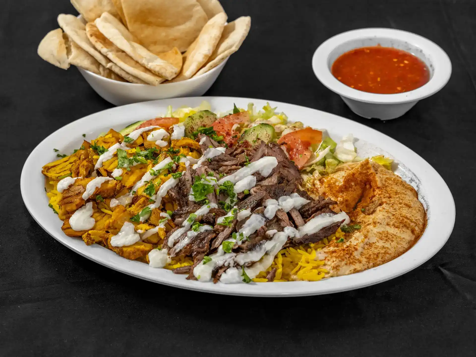 Shawarma Portion Plate at Shawarma House SD — heaping portion of hand-shaved spit shawarma over saffron basmati with garden salad and warm pita — Iraqi-Mediterranean in Ocean Beach, San Diego