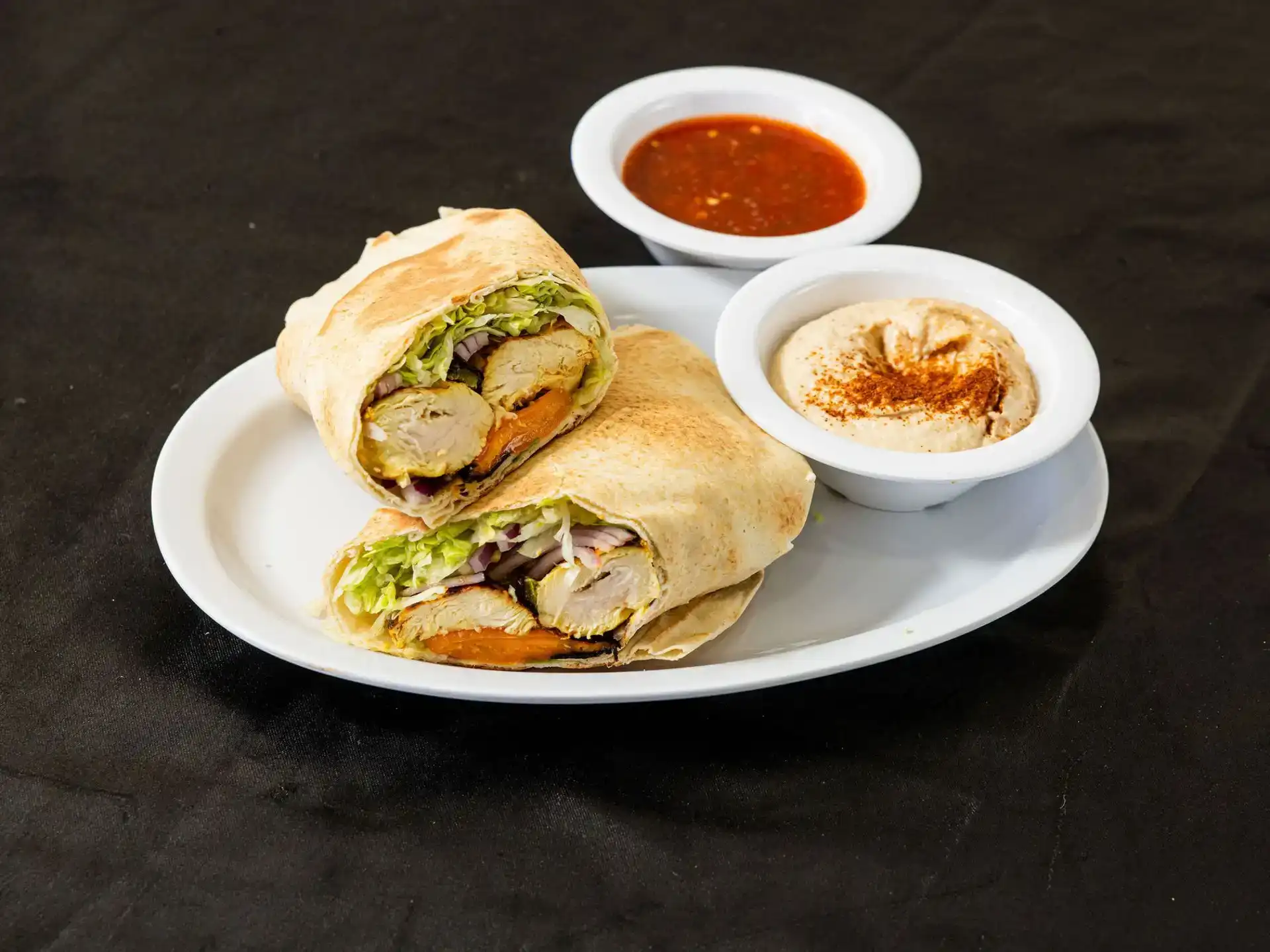 Shish Tawook Pita Wrap at Shawarma House SD — char-grilled chicken skewer in warm pita with garden salad, hummus, and toum — halal Mediterranean in Ocean Beach, San Diego