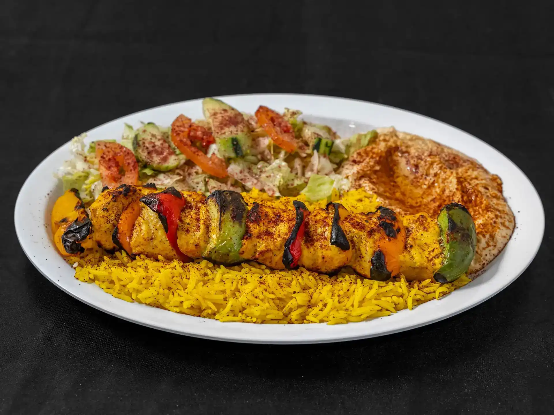Shish Tawook Plate at Shawarma House SD — char-grilled chicken skewer marinated in yogurt and Mediterranean spices over saffron basmati with crisp salad, hummus, and pita — halal in San Diego