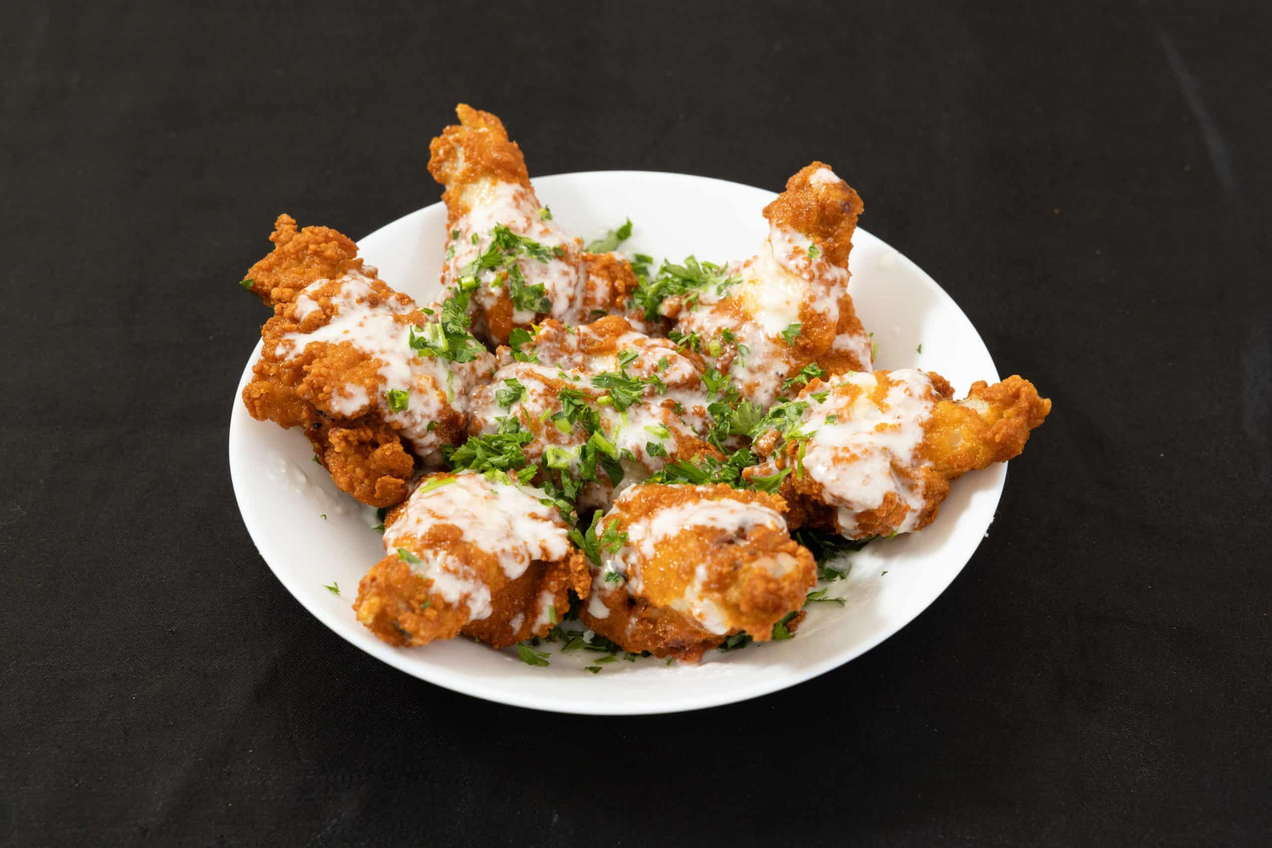 Side of 8pc Wings at Shawarma House SD — eight crispy halal chicken wings, fried to order, paired with house chili sauce — Mediterranean restaurant in Ocean Beach