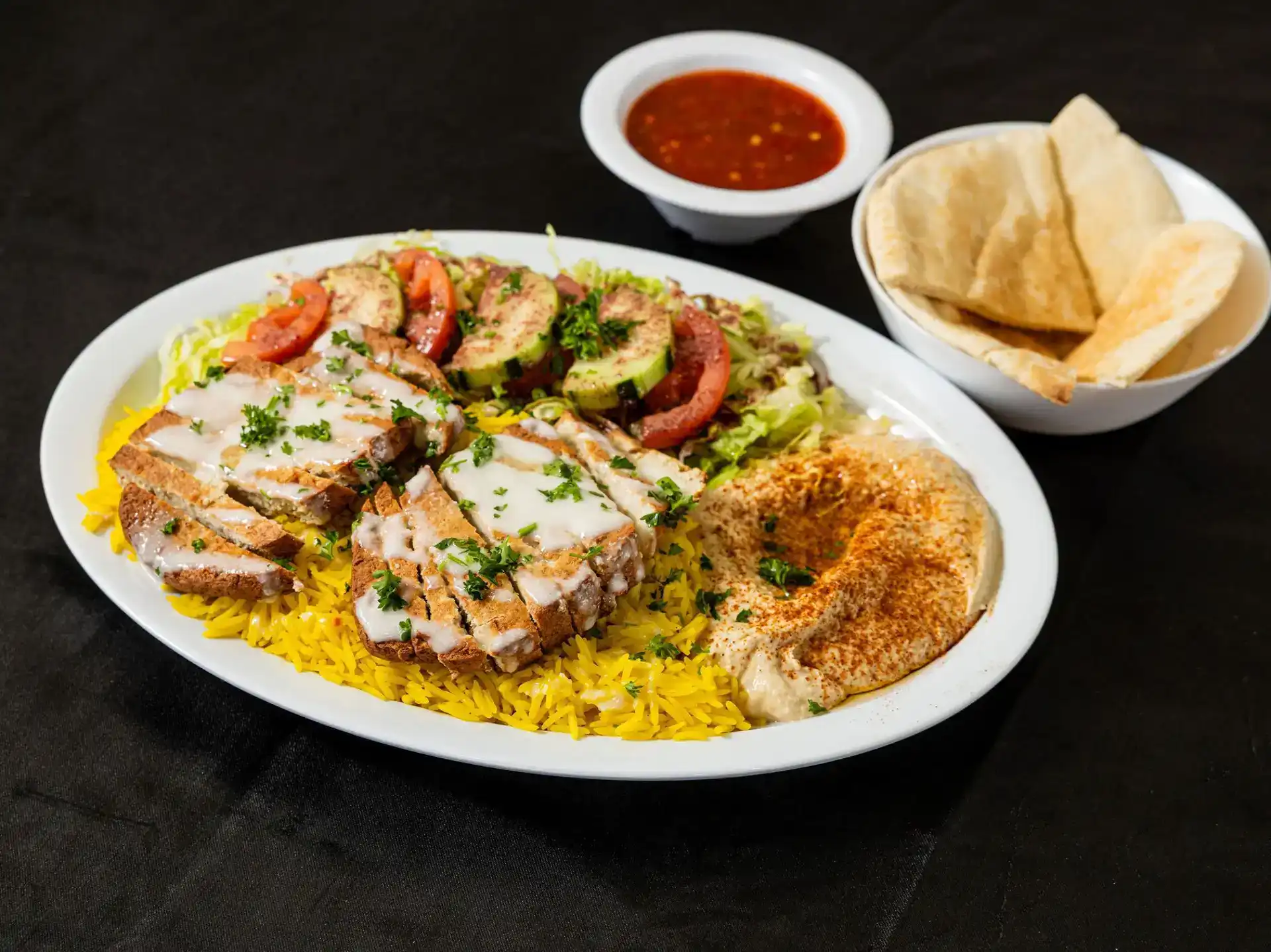 Vegan Cream Chop Plate at Shawarma House SD — plant-based cream chop with Iraqi-Mediterranean spice blend over saffron basmati with garden salad, hummus, and warm pita — 100% vegan in San Diego