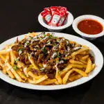 Vegan Shawarma Fries at Shawarma House SD — crispy seasoned fries loaded with plant-based shawarma, salad, and toum — 10