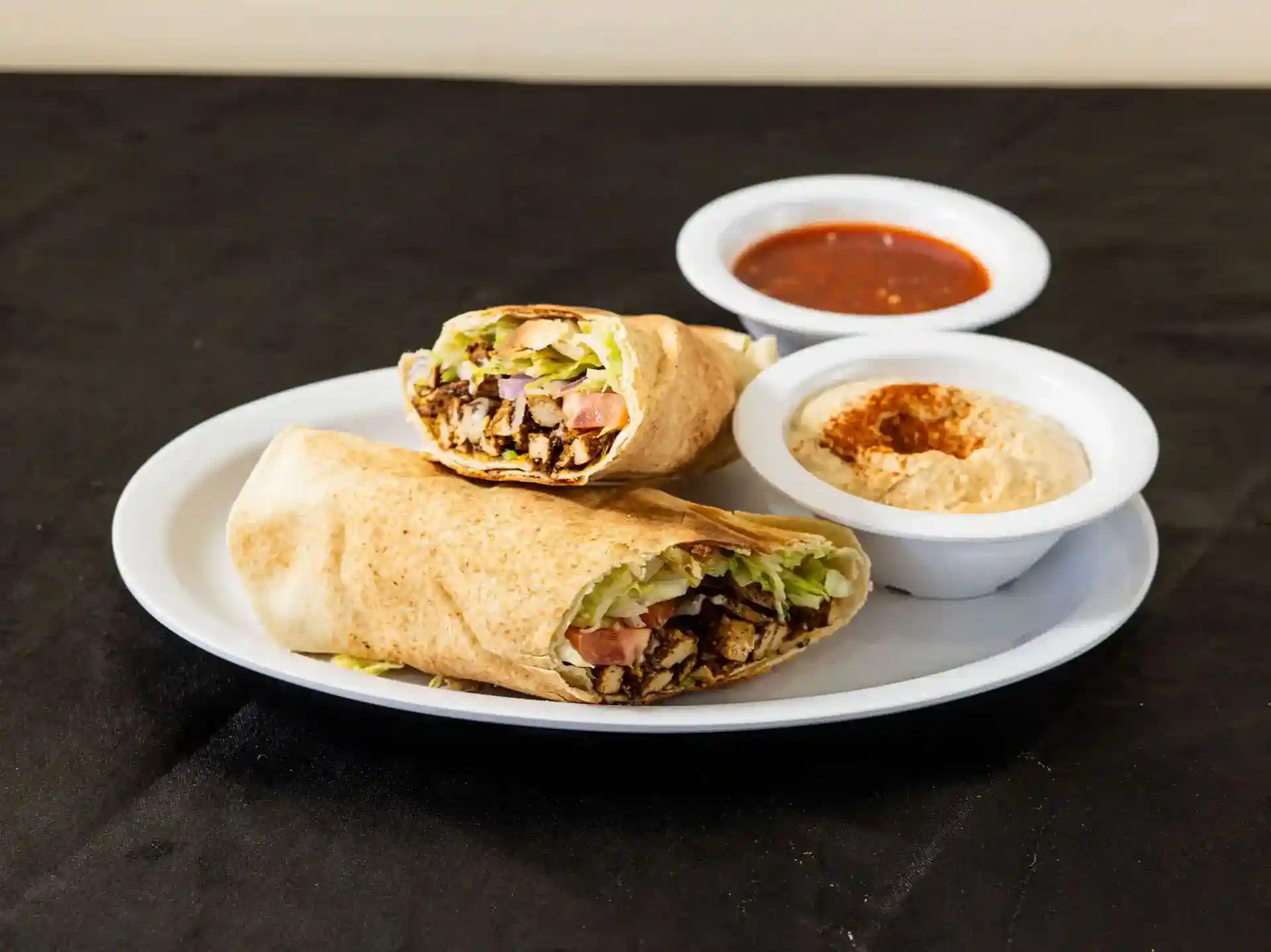 Vegan Shawarma Pita Wrap at Shawarma House SD — plant-based shawarma with baharat blend in warm pita with salad, hummus, and toum — 100% vegan Mediterranean in San Diego